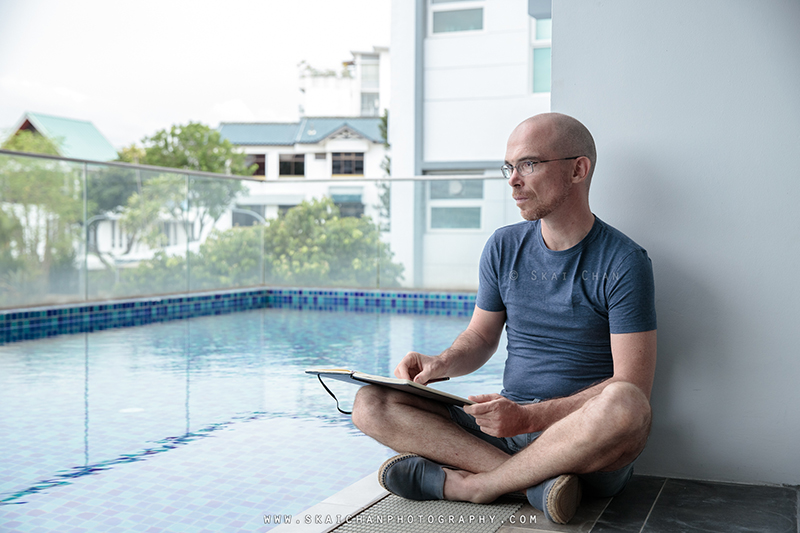 Artist sketching photoshoot with Jerome Cheze at poolside (One Robey)