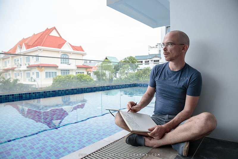 Artist sketching photoshoot with Jerome Cheze at poolside (One Robey)