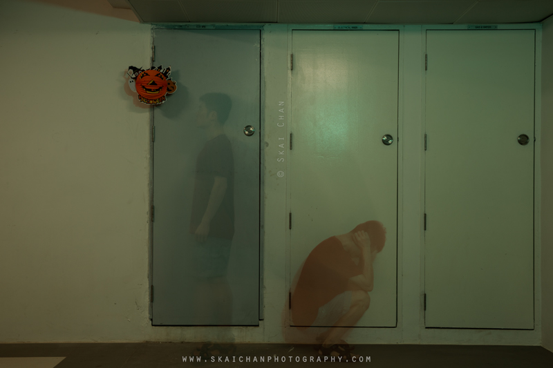 Distressed ghostly self-portrait in a dimly lit corridor, representing psychological exhaustion from the Tengah CCS saga