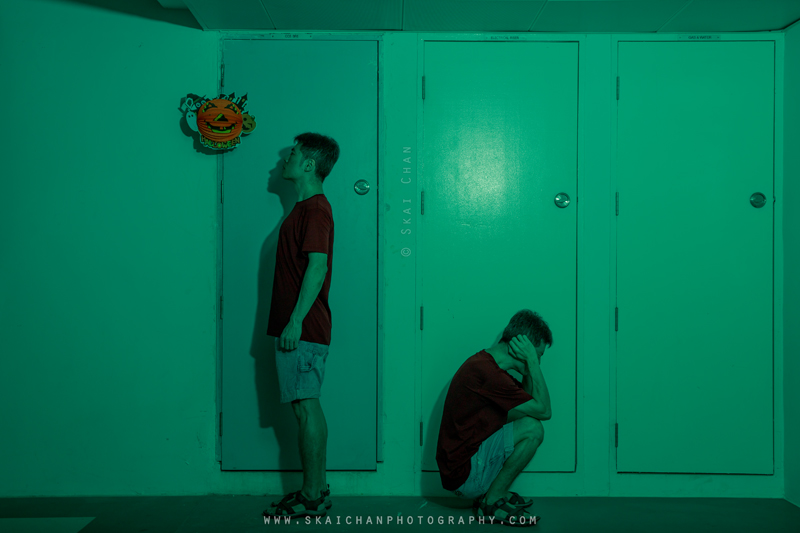 Two versions of Skai in the Tengah corridor, one standing and another crouching in distress, symbolising an internal struggle