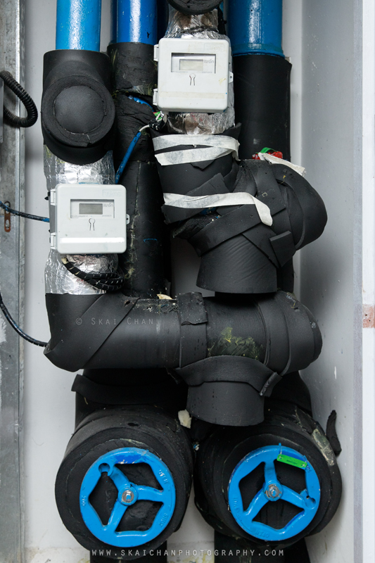 Close-up of overlapping black insulation and piping inside the Tengah CCS riser