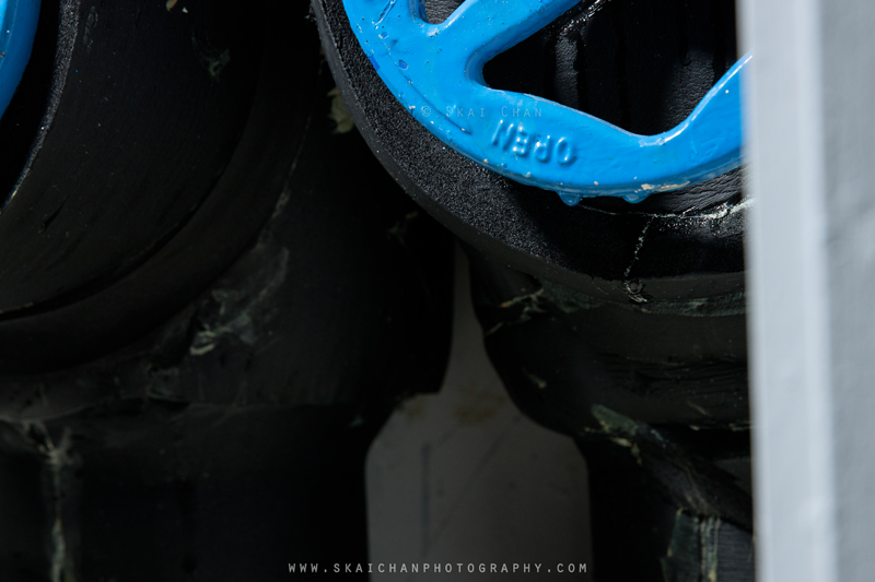 Water droplets beneath a blue valve inside the Tengah CCS riser, documenting condensation
